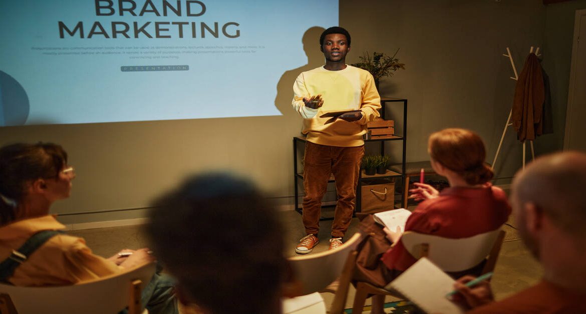 Black Young Man Presenting At Seminar Want a Brand Story That Connects Deeply?