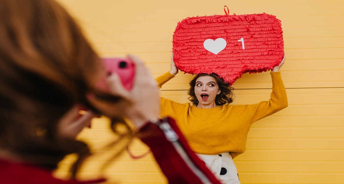 Selective focus of two girls having fun outdoor. Lovely woman in yellow sweater posing with heart i Want to Convert Followers? Storytelling Secrets?